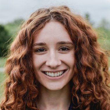 Happy ginger girl smiling on camera outdoor - Focus on face
